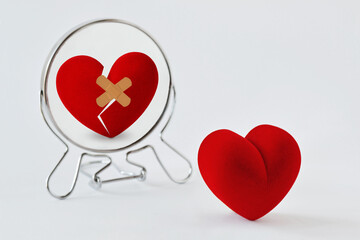 Broken heart looking in the mirror - Concept of love and pain