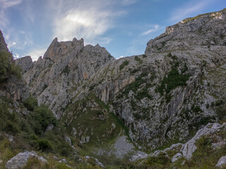 The Cares Route in the heart of Picos de Europa National Park, Cain-Poncebos, Asturias, Spain. Narrow and impressive canyon between cliffs, bridges, caves, footpaths and rocky mountains.