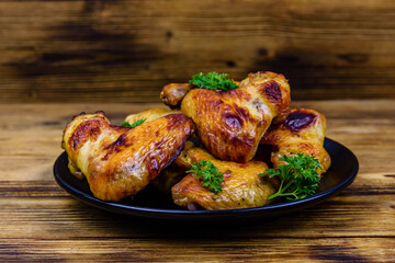 Pile of the roasted chicken wings on plate