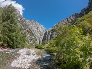 Fototapeta na wymiar The Cares river near Caín village (León), the route of the Cares Canyon, Picos de Europa National Park, between Asturias and Leon provinces, Spain.