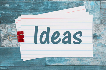 Ideas message on white paper index cards weathered wood