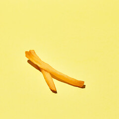 French fries on yellow background