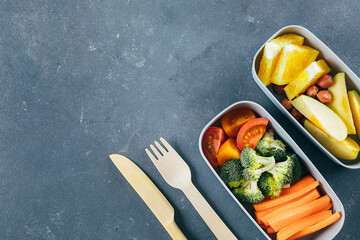 Lunch box with vegetables and fruits. Delicious balanced food concept. Top view, copy space