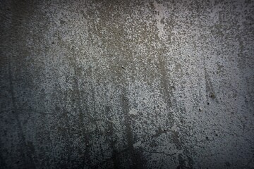 The shadow of the old gray cement wall surface with cracks