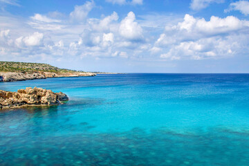Fototapeta na wymiar Beautiful landscape at Cavo Greco in Ayia Napa, Cyprus island, Mediterranean Sea. Amazing blue sea during a sunny day.
