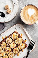 large waffles with filling on a gray background with coffee