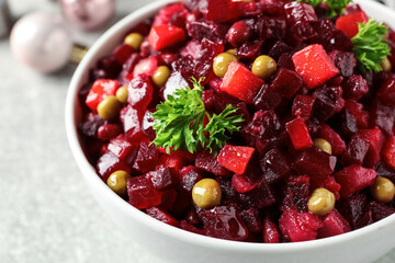 Traditional Russian salad vinaigrette in bowl, closeup