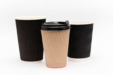 three cardboard cups for coffee on a white background