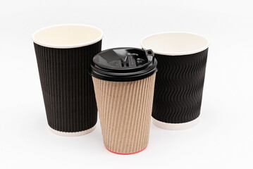 three cardboard cups for coffee on a white background