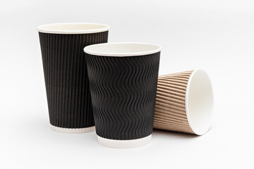 three empty cardboard cups for coffee on a white background