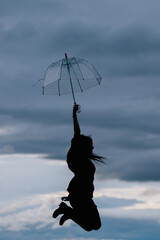silhouette of a young woman jumping