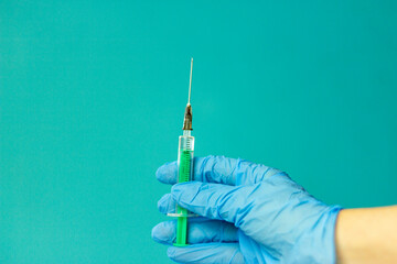 Medical vials for injection, syringe for injection, mask gloves on a blue background. Admission vaccination, flu shot.