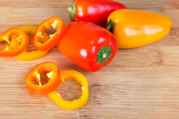 Fresh pepper ingredients over a cutting board