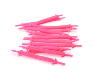 Pink silicone shoe laces on white background
