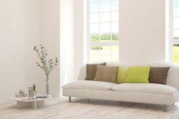 Fototapeta premium White living room with sofa and summer landscape in window. Scandinavian interior design. 3D illustration