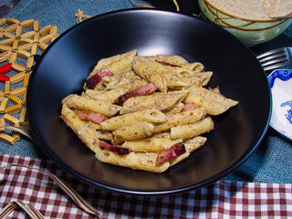 pens with lentil cream, speck and anchovies