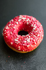 donut sweet dessert raspberries or strawberry berry filling pink icing portion on the table for healthy meal snack top view copy space for text food background rustic