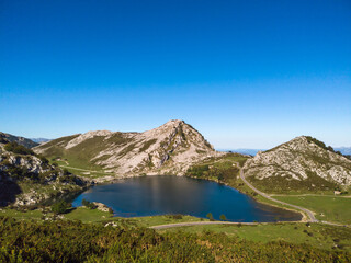 Fototapeta na wymiar The Lakes of Covadonga. The Lake Enol is a small highland lake in the Principality of Asturias, Spain. It is located in the Picos de Europa Western Massif, Cantabrian Mountains.