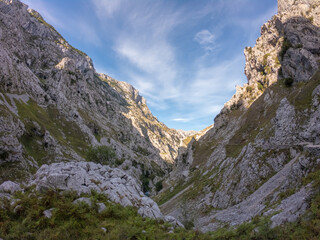 The Cares Route in the heart of Picos de Europa National Park, Cain-Poncebos, Asturias, Spain. Narrow and impressive canyon between cliffs, bridges, caves, footpaths and rocky mountains.