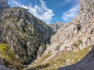 The Cares Route in the heart of Picos de Europa National Park, Cain-Poncebos, Asturias, Spain. Narrow and impressive canyon between cliffs, bridges, caves, footpaths and rocky mountains.