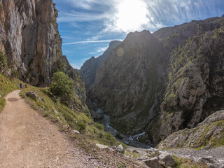 The Cares Route in the heart of Picos de Europa National Park, Cain-Poncebos, Asturias, Spain. Narrow and impressive canyon between cliffs, bridges, caves, footpaths and rocky mountains.