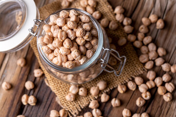 Dried raw chickpea on the wooden background
