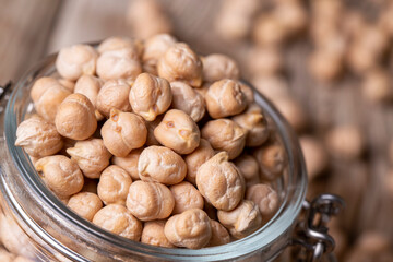 Dried raw chickpea on the wooden background