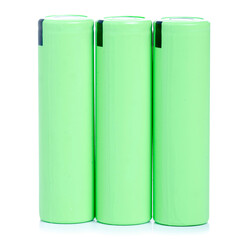 Green 18650 battery power on white background isolation