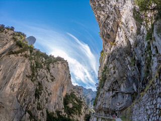 The Cares Route in the heart of Picos de Europa National Park, Cain-Poncebos, Asturias, Spain. Narrow and impressive canyon between cliffs, bridges, caves, footpaths and rocky mountains.