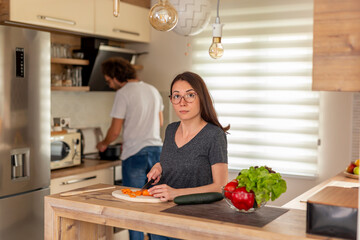 Couple cooking lunch together