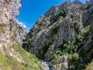 The Los Rebecos (chamois) bridge at the Cares Route in the heart of Picos de Europa National Park, Cain-Poncebos, Asturias, Spain. This walkway comes from reservoir of Doiras.