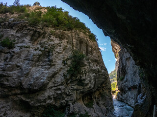 The Cares Route in the heart of Picos de Europa National Park, Cain-Poncebos, Asturias, Spain. Narrow and impressive canyon between cliffs, bridges, caves, footpaths and rocky mountains.