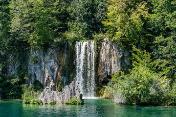 Fototapeta na wymiar Waterfall cascade in Plitvice Lakes in Croatia summer
