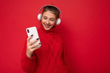 Photo of beautiful joyful smiling young woman wearing stylish casual clothes isolated over...