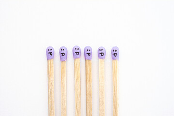 Multicolored matchsticks with faces painted on the heads