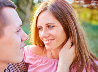 Young couple in love outdoor.Stunning sensual outdoor portrait of young stylish fashion couple posing in summer in field.