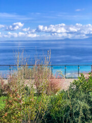 A beautiful summer day in Greece with magical sky with some clouds and calm blue sea, photo taken in nature