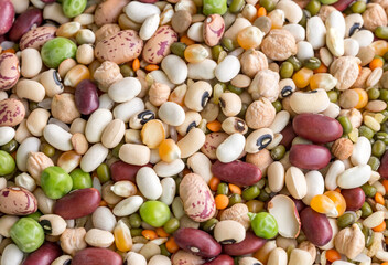 Mixed dried legumes and cereals isolated on white background, top view