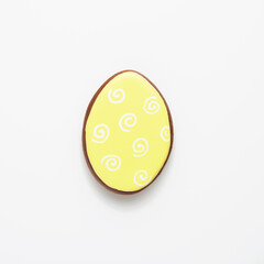 Easter symbol yellow gingerbread egg isolated on white. Top view.