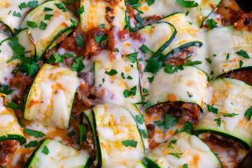 Mushroom Zucchini Lasagna Rolls in a Cast Iron Skillet: Zucchini filled with a mixture of Italian cheeses, mushrooms, and tomato sauce