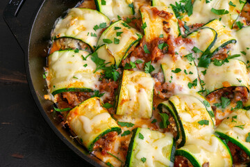 Mushroom Zucchini Lasagna Rolls in a Cast Iron Skillet: Zucchini filled with a mixture of Italian cheeses, mushrooms, and tomato sauce