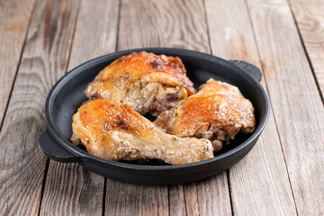 Baked chicken in a pan, homemade food