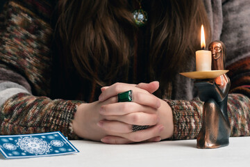Fortune teller is reading the future with tarot cards close up.