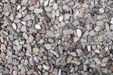 Stone pattern abstract ravel texture small stones, little rocks, pebbles in many shades of grey, white, brown, pink colour in close-up for granite texture background