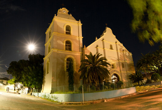 Facade on an ancient chathedral and with full moon behind