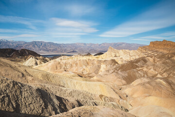 Bright and sunny view of Zabriskie Point in Death Valley, California