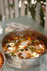 Quinoa and vegetable meal, served on the table outdoor. Selective focus.
