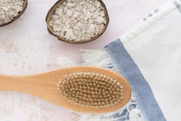 Sea salt , towel, massage wooden brush on white background