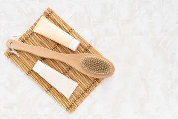 Natural brush made of wood and cream on white background