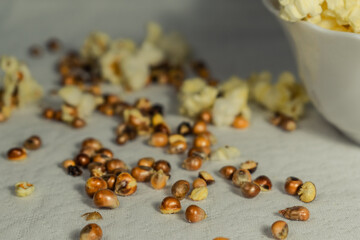 Popcorn grains on the table. Close up.